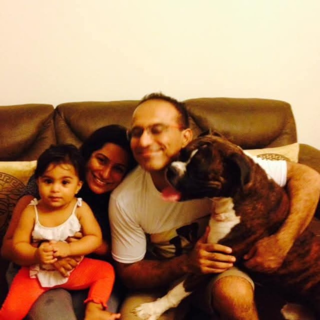 The family with baby Evika and Brutus on the couch