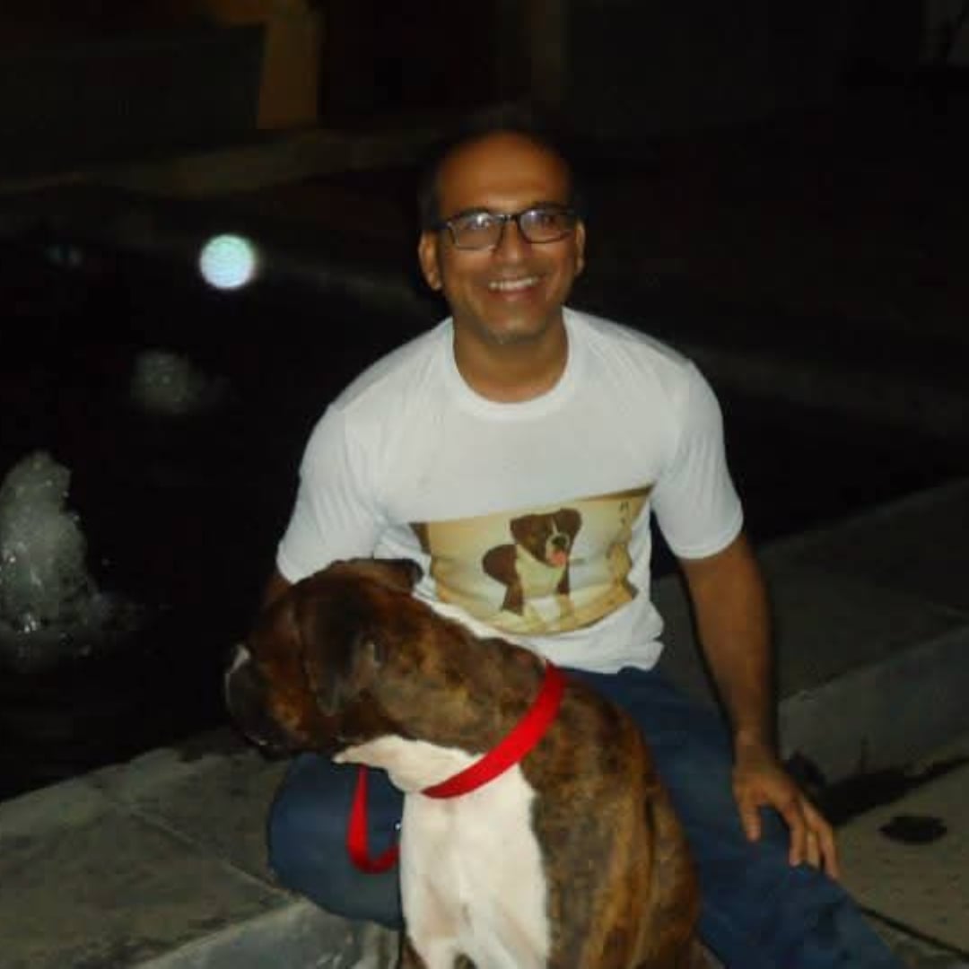 A father with Brutus by a fountain at night